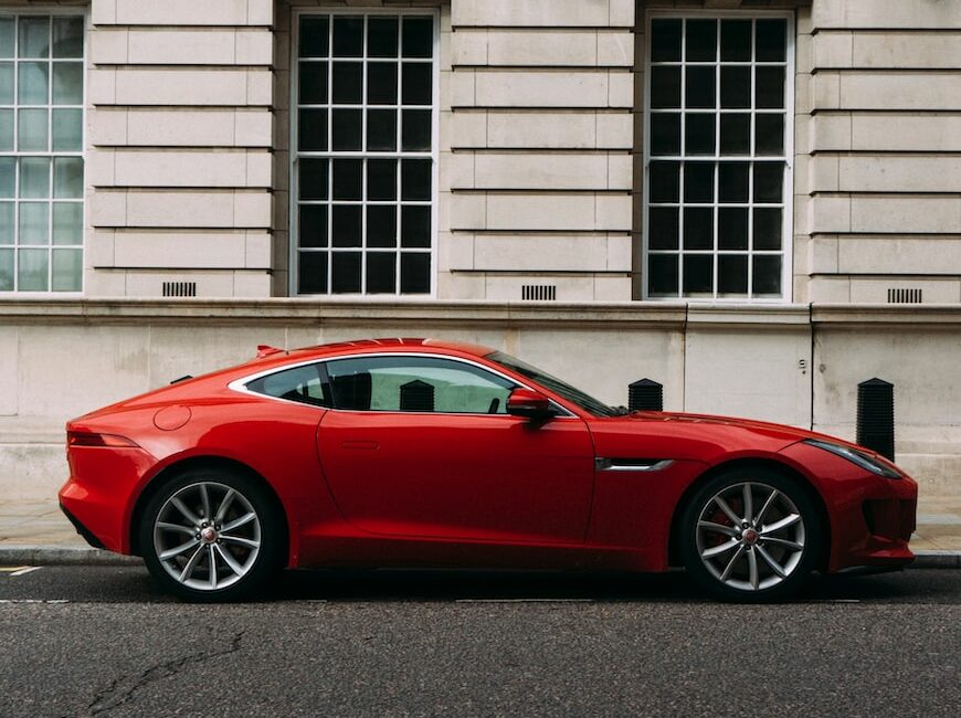 red coupe during daytime